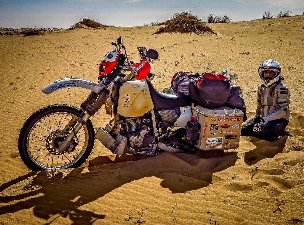 Christina Riding a Motorcycle in Africa